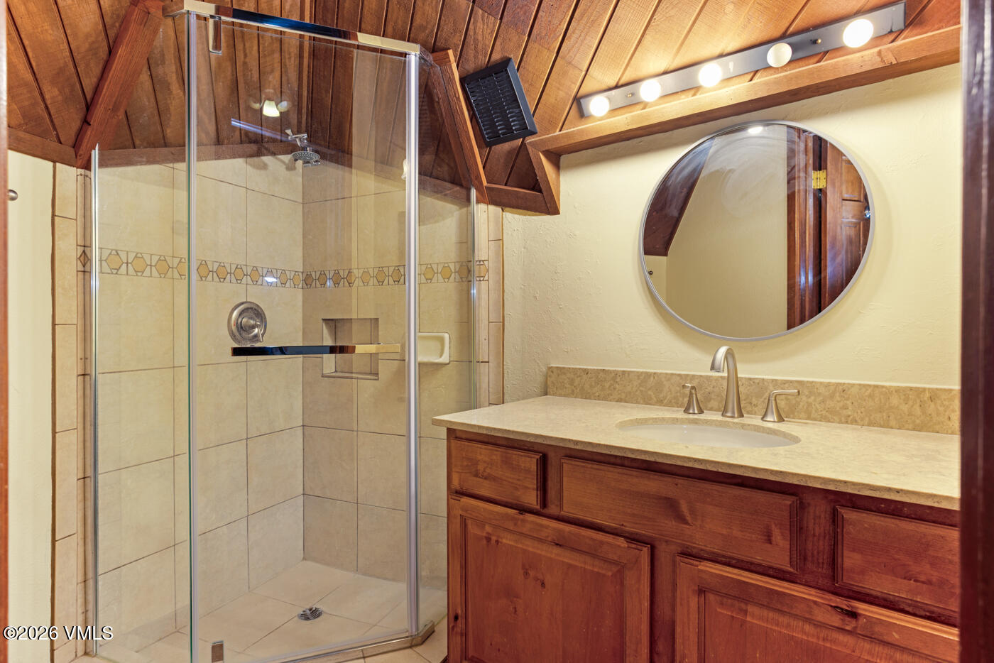 1400 Lions Ridge Loop, Unit A1 Vail, CO 81657 - Photo 19 of 41 a bathroom with a sink and a mirror