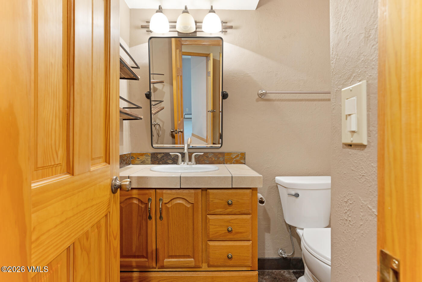 1400 Lions Ridge Loop, Unit A1 Vail, CO 81657 - Photo 26 of 41 a bathroom with a sink and a mirror