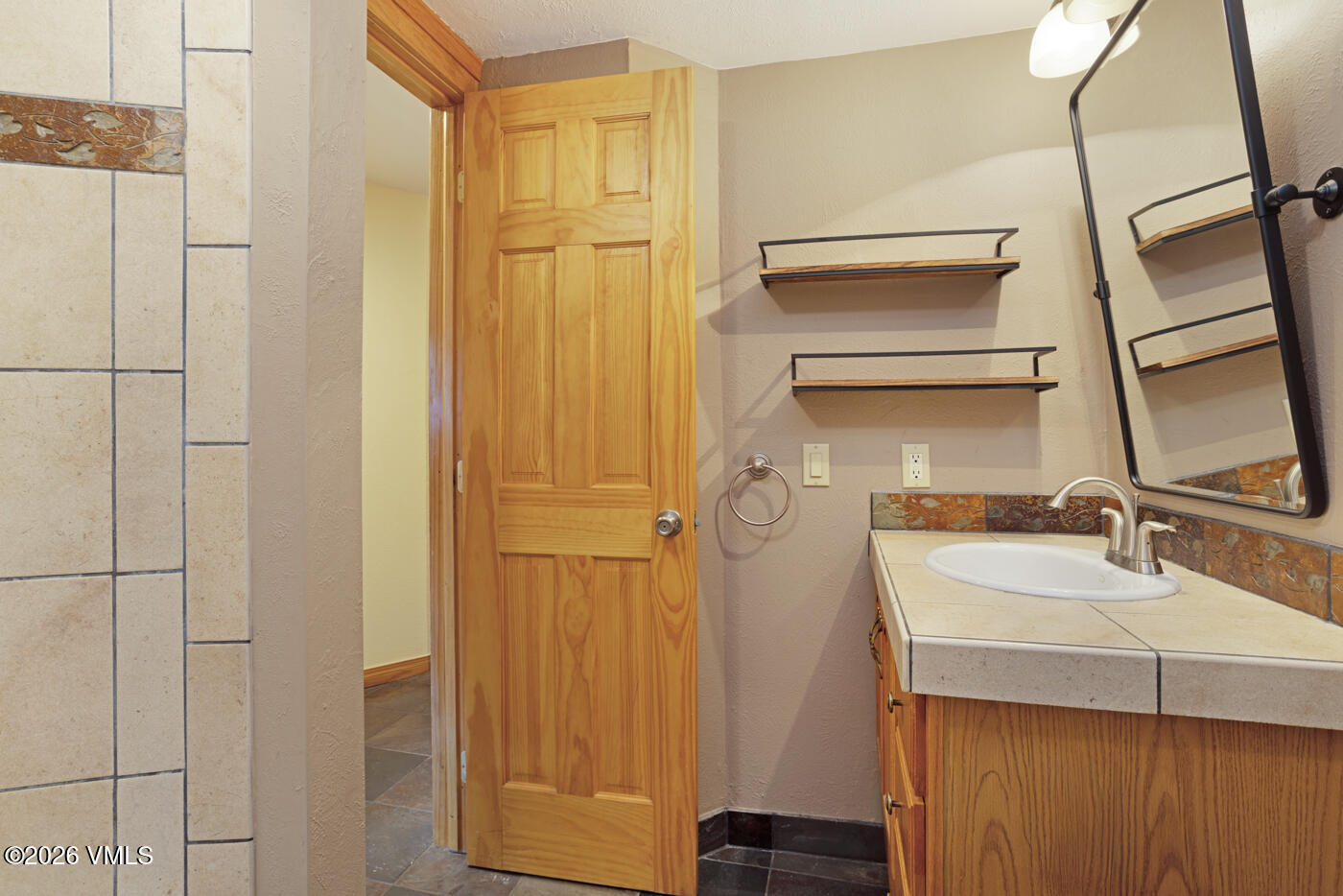 1400 Lions Ridge Loop, Unit A1 Vail, CO 81657 - Photo 27 of 41 a bathroom with a sink and a mirror
