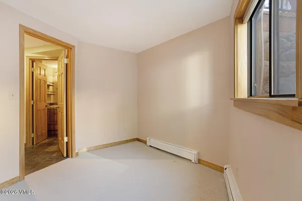 a view of a balcony with wooden floor