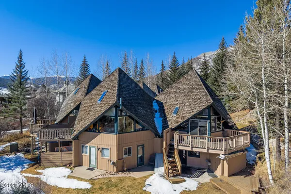 a view of a terrace with a garden and mountain view