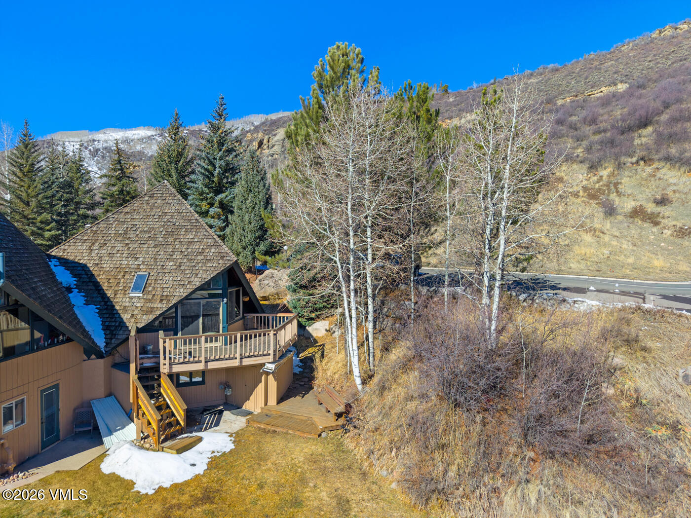 1400 Lions Ridge Loop, Unit A1 Vail, CO 81657 - Photo 37 of 41 a view of a house with a yard