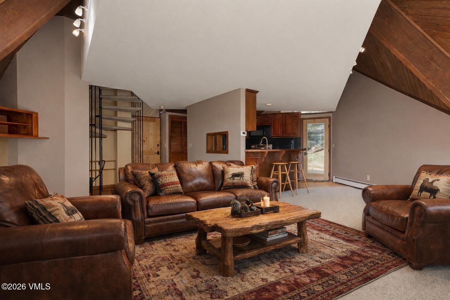 1400 Lions Ridge Loop, Unit A1 Vail, CO 81657 - Photo 6 of 41 a living room with furniture and a couch