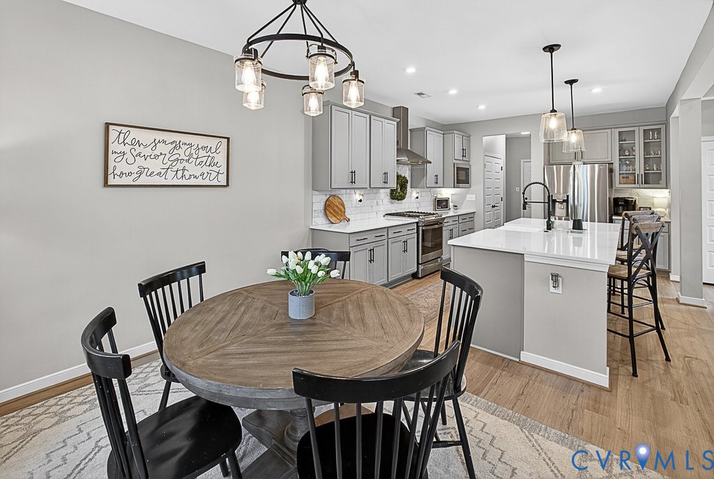 18517 Palisades Ridge Moseley, VA 23120 - Photo 11 of 55 a view of a dining room with furniture and wooden floor