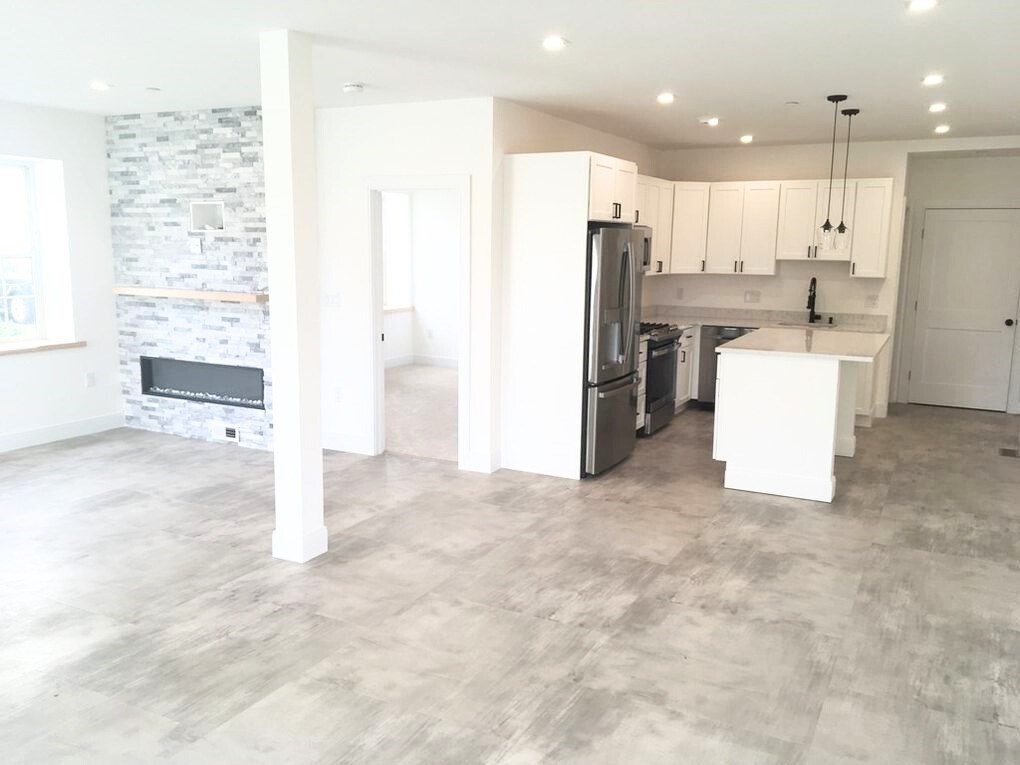 2239 Washington Street, Unit 102 Canton, MA 02021 - Photo 2 of 12 a view of kitchen with refrigerator cabinets and ceiling fan