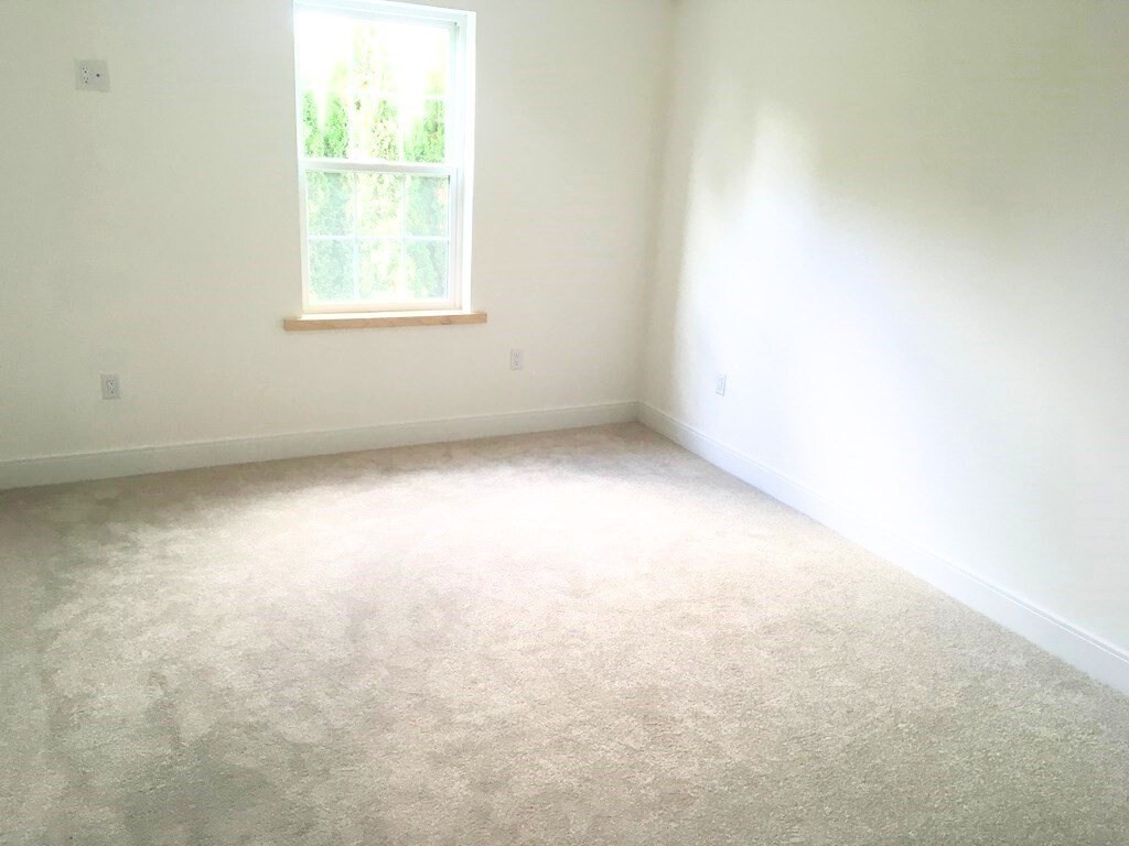 2239 Washington Street, Unit 102 Canton, MA 02021 - Photo 10 of 12 an empty room with a window