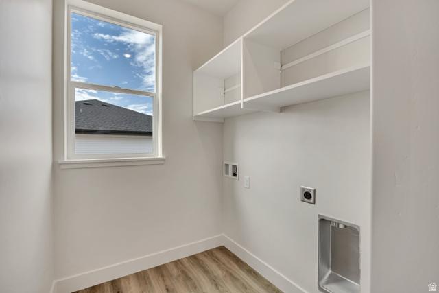 3839 West 825 North, Unit WF18 West Point, UT 84015 - Photo 16 of 22 Laundry area with washer hookup, light wood finished floors, and hookup for an electric dryer