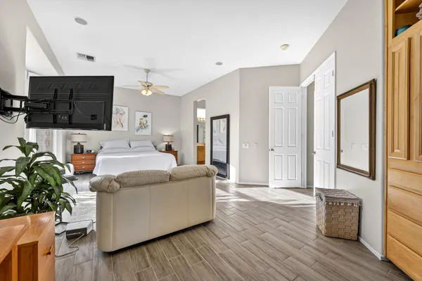 a living room with furniture and a potted plant