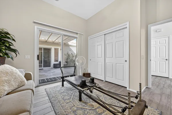 a living room with furniture stove and a table