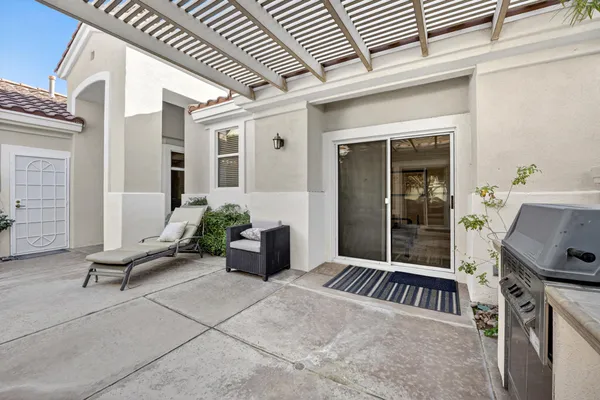 a view of an entryway with a backyard