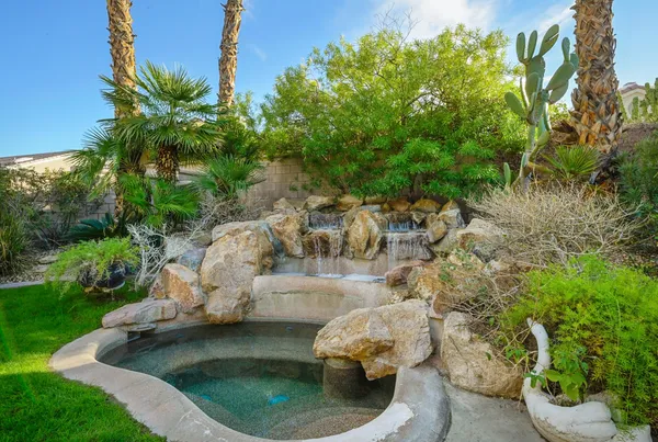 a backyard of a house with outdoor seating