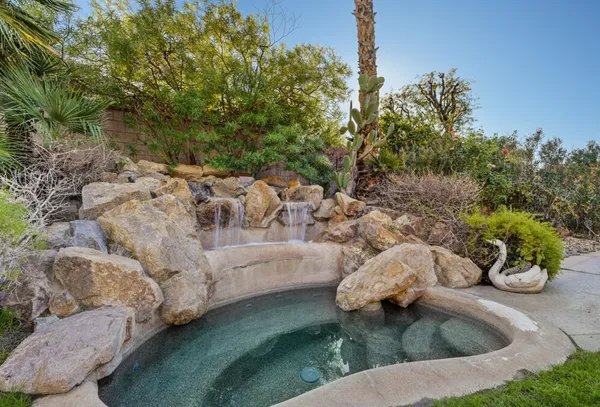 a view of swimming pool with patio