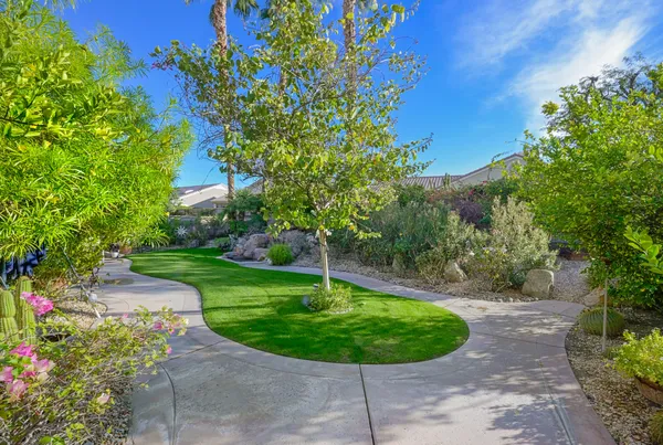 a view of a backyard with a fountain