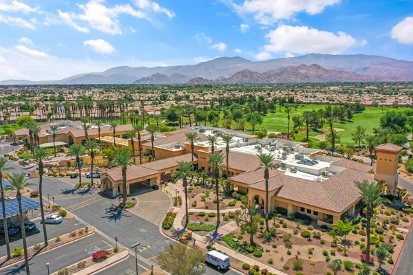 a view of a terrace with a table and chairs