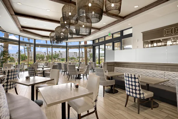 a outdoor space with lots of furniture and glass door