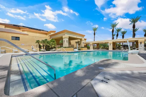 a view of swimming pool with outdoor seating