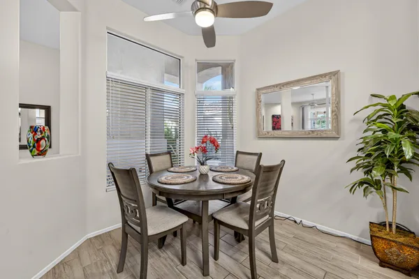 a view of a dining room with furniture and wooden floor