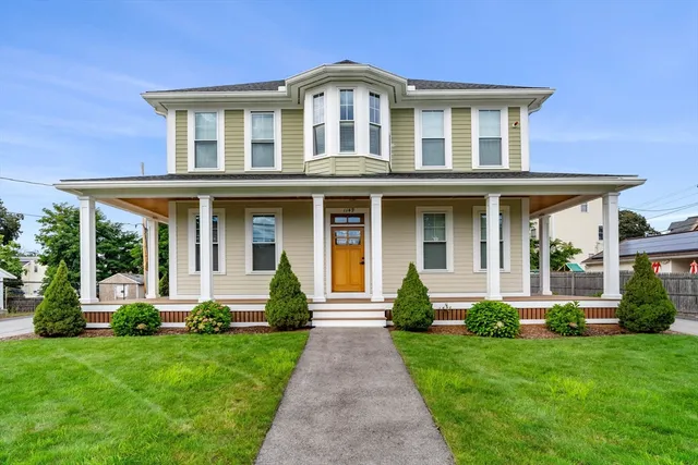 front view of a house with a yard