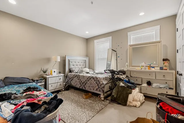 a bed room with furniture and a window