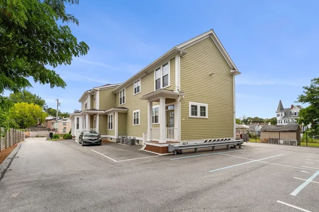 a view of a street with a building in the background