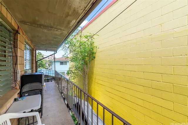 a view of balcony with furniture