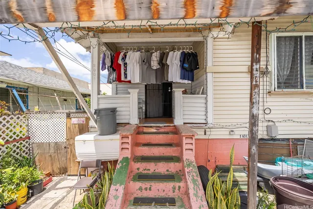 a front view of a house with outdoor seating