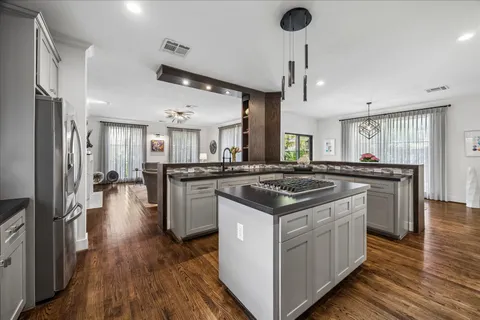 a dining room with furniture window and wooden floor