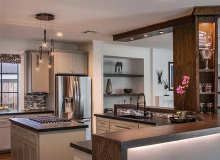 a kitchen with stainless steel appliances granite countertop a stove and a refrigerator