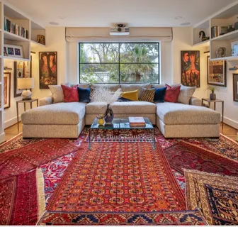 a living room with furniture and a rug