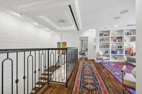 a living room with furniture and a rug