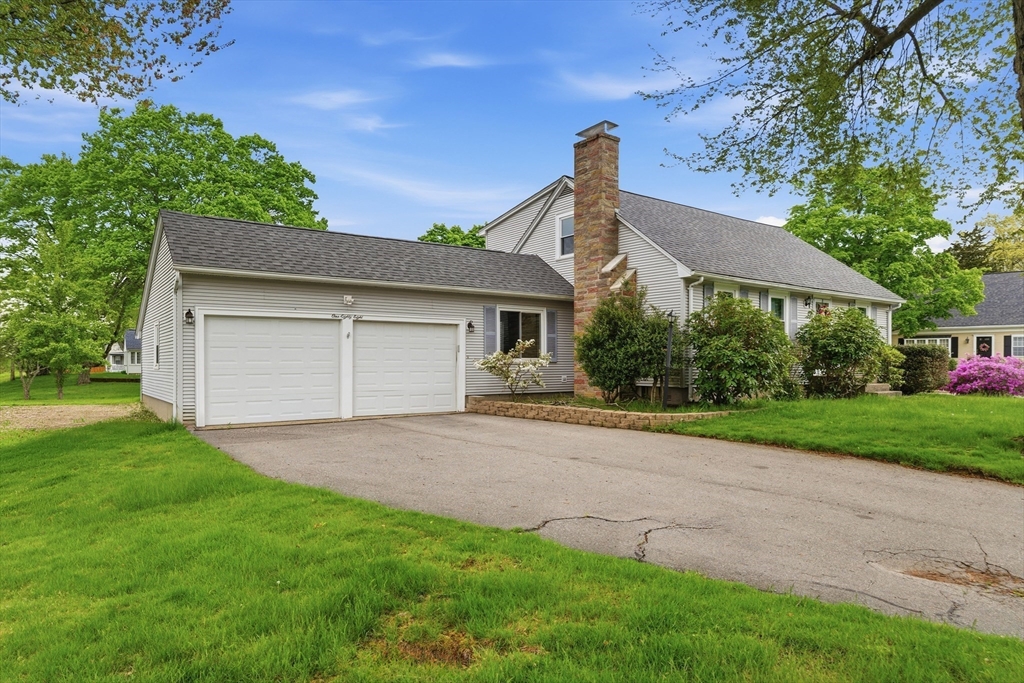188 Glendale Road Attleboro, MA 02703 - Photo 31 of 37 a front view of a house with a yard and garage