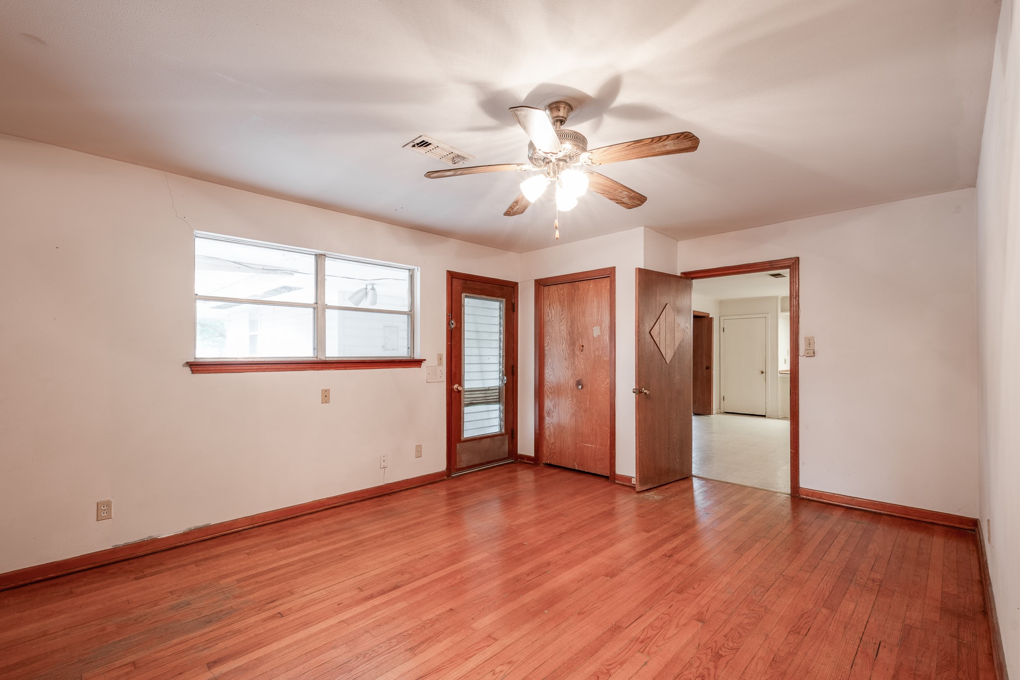 17427 Strack Drive West Spring, TX 77379 - Photo 17 of 25 a view of an empty room with window and wooden floor