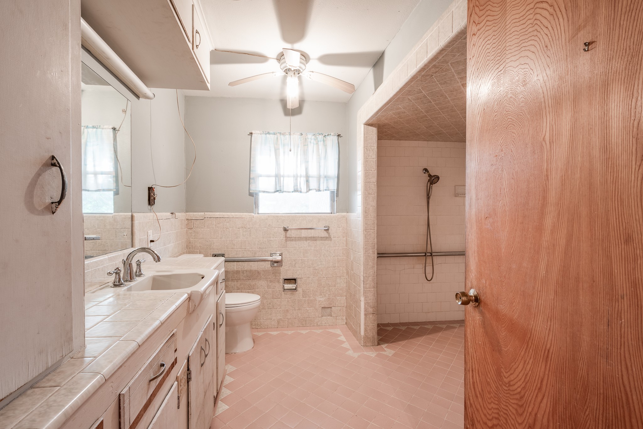 17427 Strack Drive West Spring, TX 77379 - Photo 18 of 25 a bathroom with a double vanity sink toilet and shower
