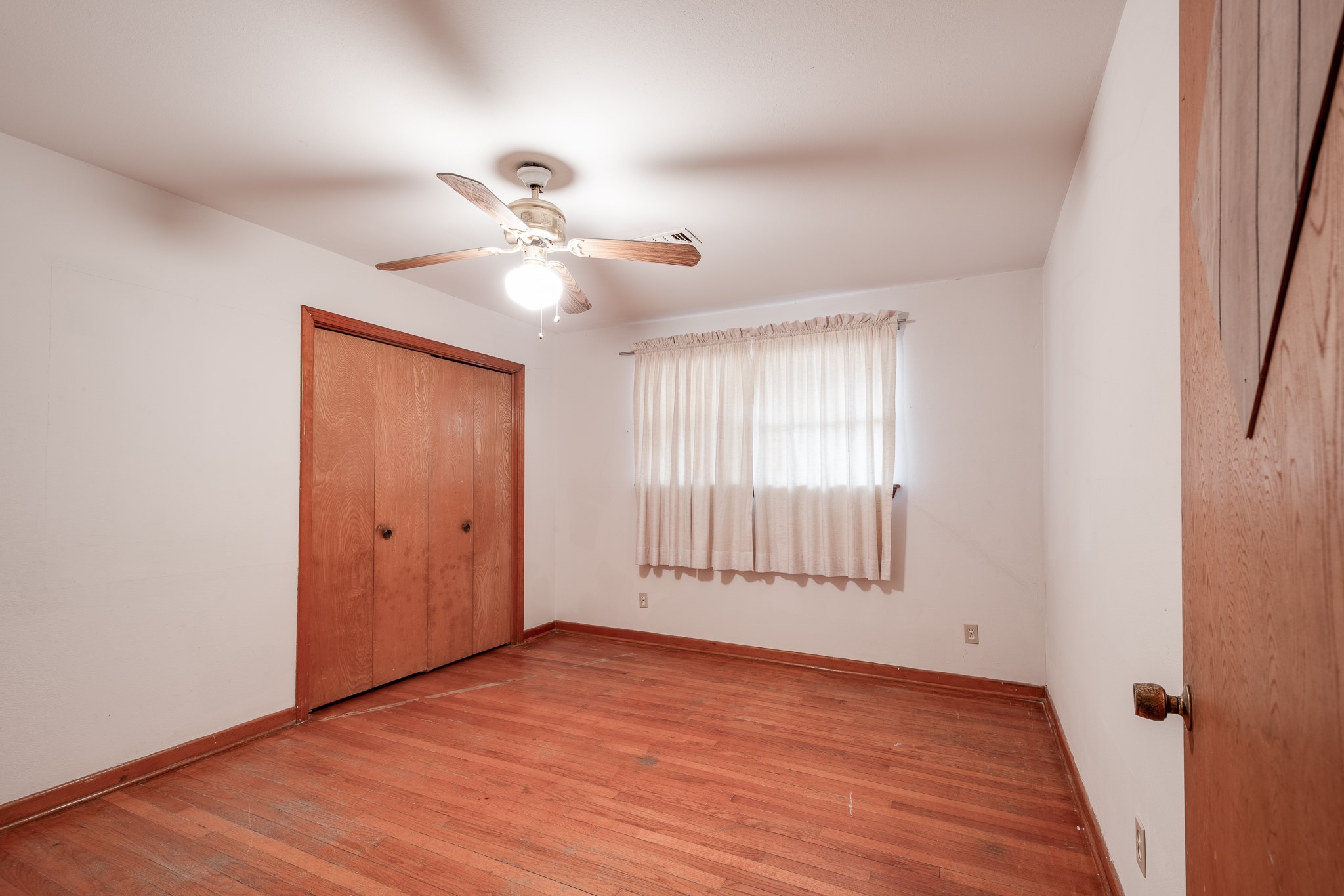 17427 Strack Drive West Spring, TX 77379 - Photo 21 of 25 wooden floor in an empty room with a window