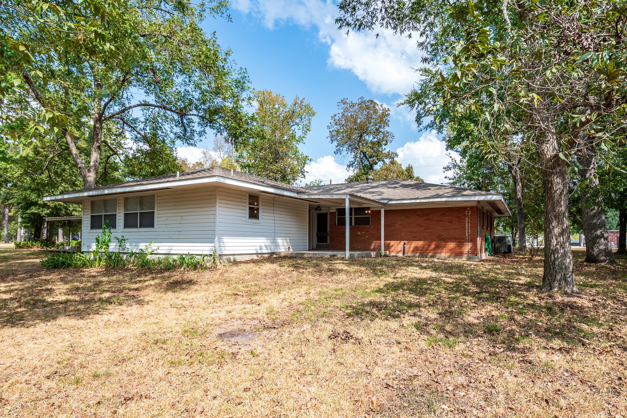 17427 Strack Drive West Spring, TX 77379 - Photo 7 of 25 a front view of a house with a garden