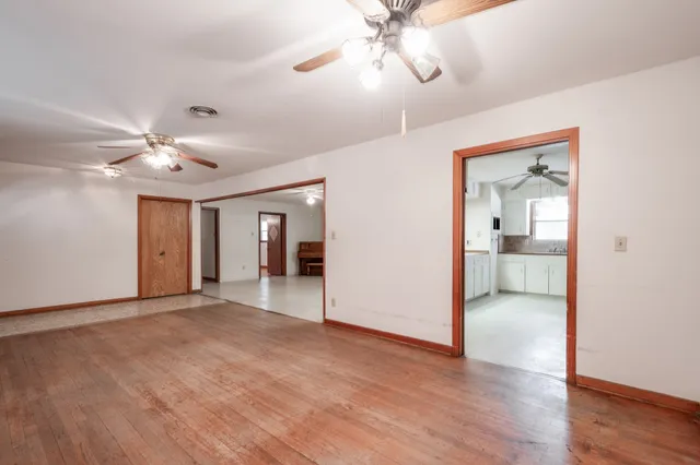 a view of an empty room with a bathroom