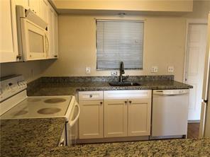 3850 Northeast 21st Way, Unit 62 Lighthouse Point, FL 33064 - Photo 5 of 13 a bathroom with a granite countertop sink and a mirror
