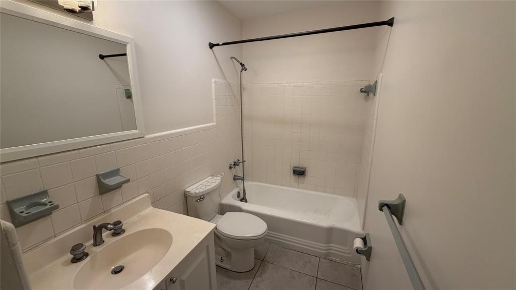 3850 Northeast 21st Way, Unit 62 Lighthouse Point, FL 33064 - Photo 6 of 13 a bathroom with a sink toilet and shower