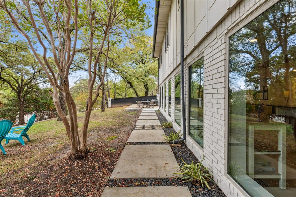 7342 Briar Road Azle, TX 76020 - Photo 33 of 40 Hardscaped walkway connects downstairs outdoor living areas