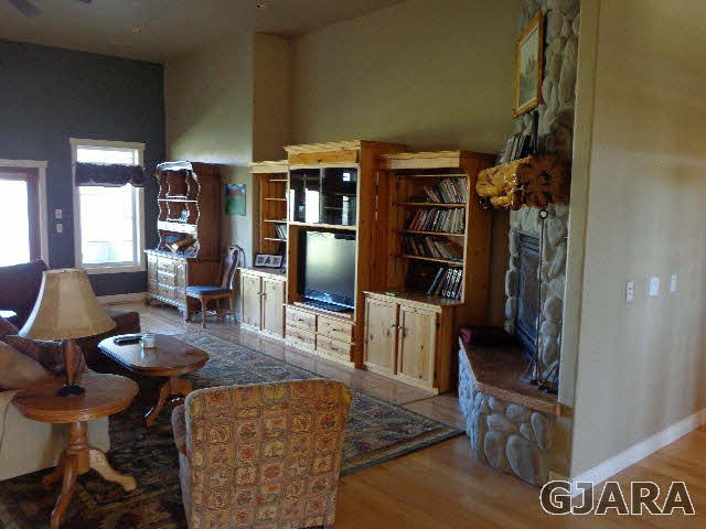 1427 19 Road Fruita, CO 81521 - Photo 11 of 23 a view of a livingroom with furniture and a bookshelf