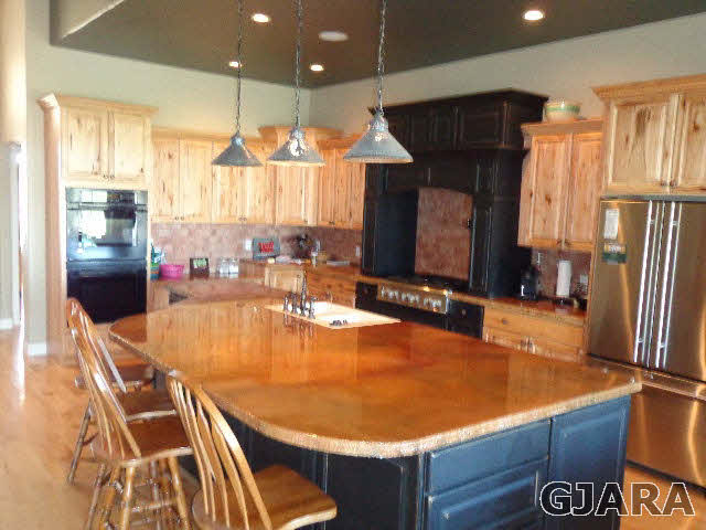 1427 19 Road Fruita, CO 81521 - Photo 13 of 23 a room with wooden floor pool table and chairs