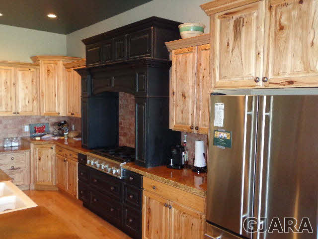 1427 19 Road Fruita, CO 81521 - Photo 14 of 23 a kitchen with stainless steel appliances granite countertop a refrigerator and a stove