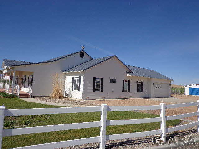 1427 19 Road Fruita, CO 81521 - Photo 2 of 23 a front view of a house with a yard