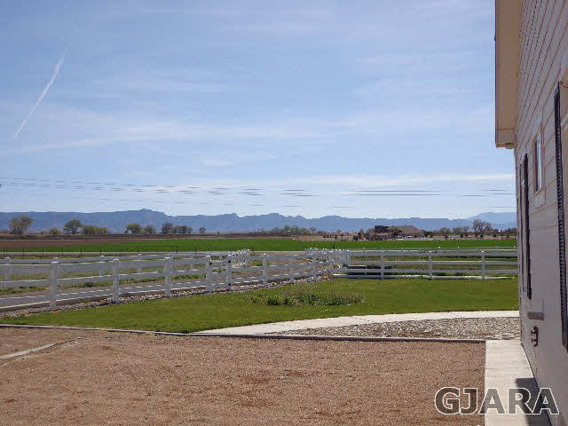 1427 19 Road Fruita, CO 81521 - Photo 4 of 23 a view of a city with an ocean beach