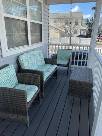 a view of a balcony with furniture