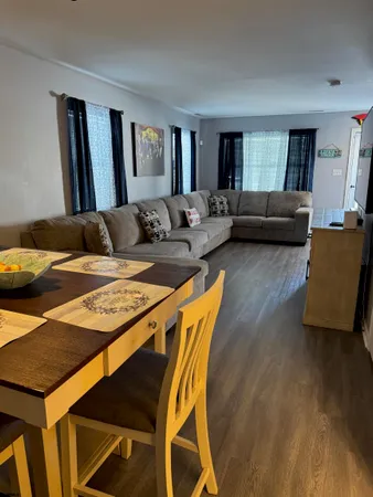 a living room with furniture and a rug
