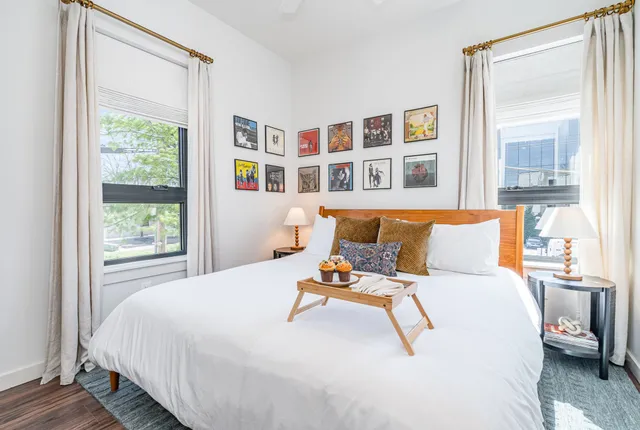 a bedroom with a bed and cabinets
