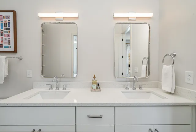 a bathroom with a sink vanity and a mirror