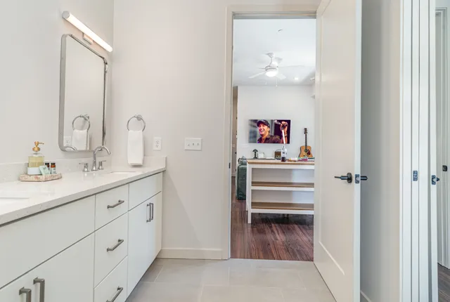 a bedroom with a bed and a book shelf