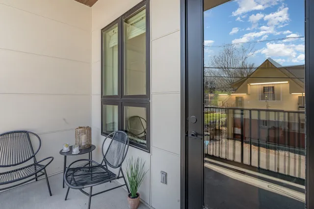 a outdoor living space with patio furniture and a wooden floor